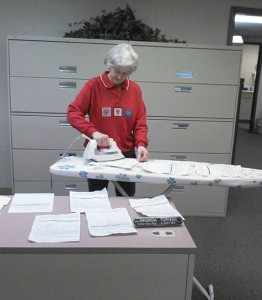 Clay County Arkansas FSA Employee Rhonda Turner is shown here ironing ARC/PLC paperwork