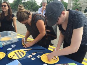 USDA Employees create bee fans at Pollinator Festival