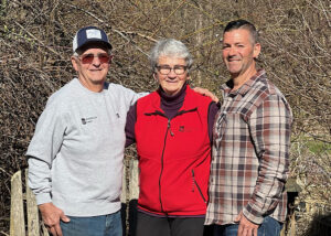 Chris (right) with his parents, Pat, in the center and Richard on the left. 