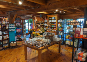 Inside of the farm stand with various products displayed.